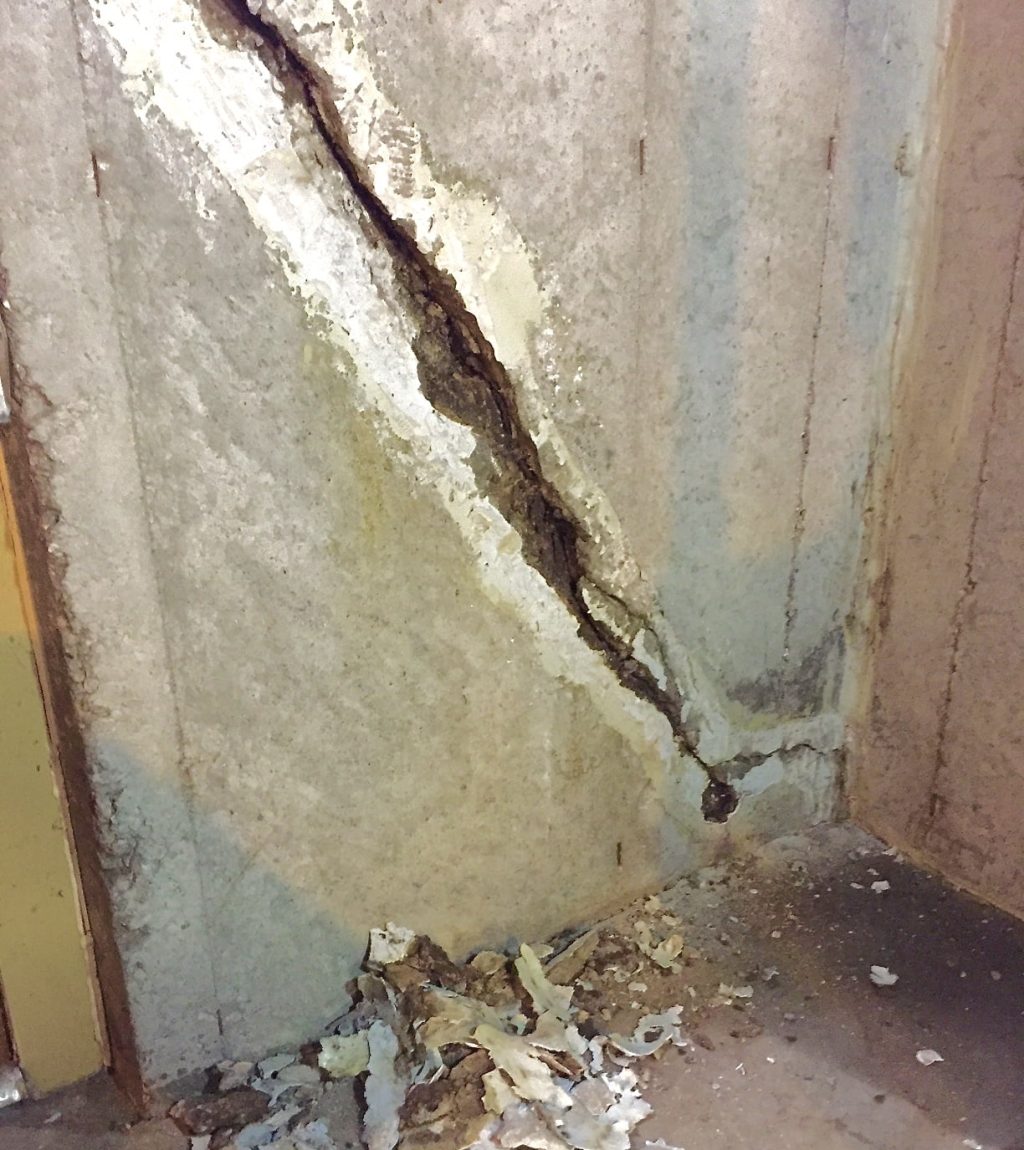 A basement crack that has been cleaned and prepared for carbon fiber repair
