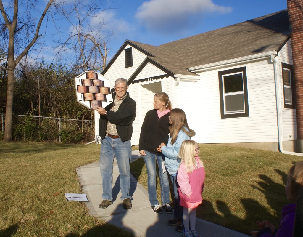Fuller Center recieving family presented with house